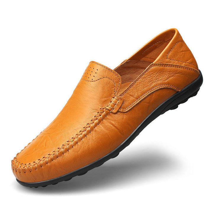 Side view of men's perforated slip-on loafers with classic moc toe stitching