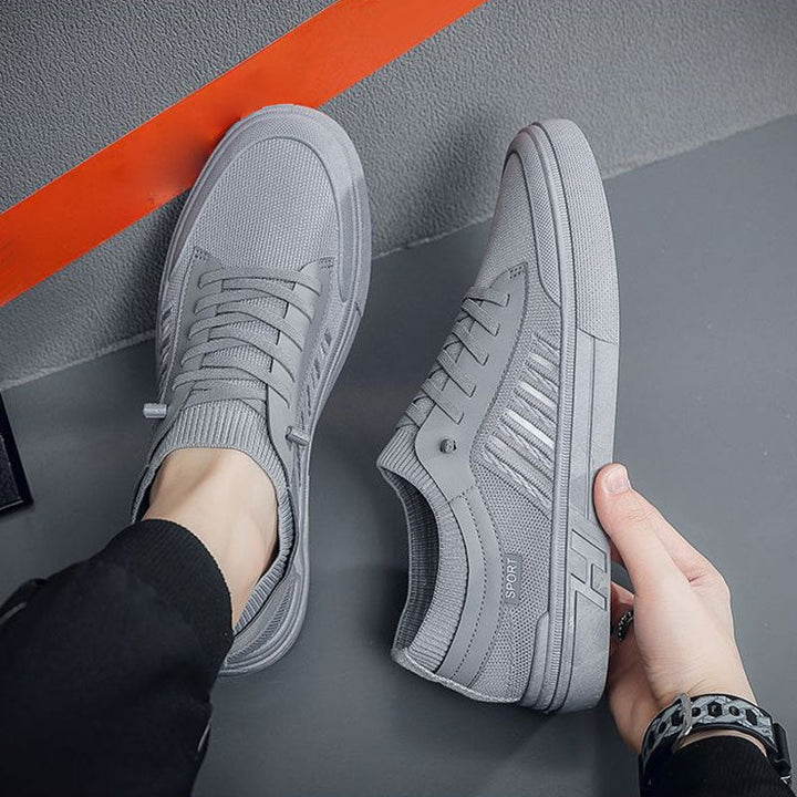 Angled side view of men's slip-on trainers highlighting the casual everyday style