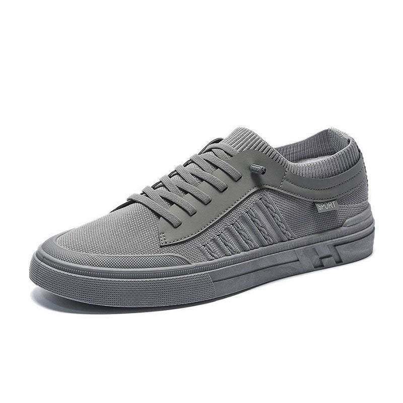 Pair of men's everyday slip-on trainers shown from an angled front view