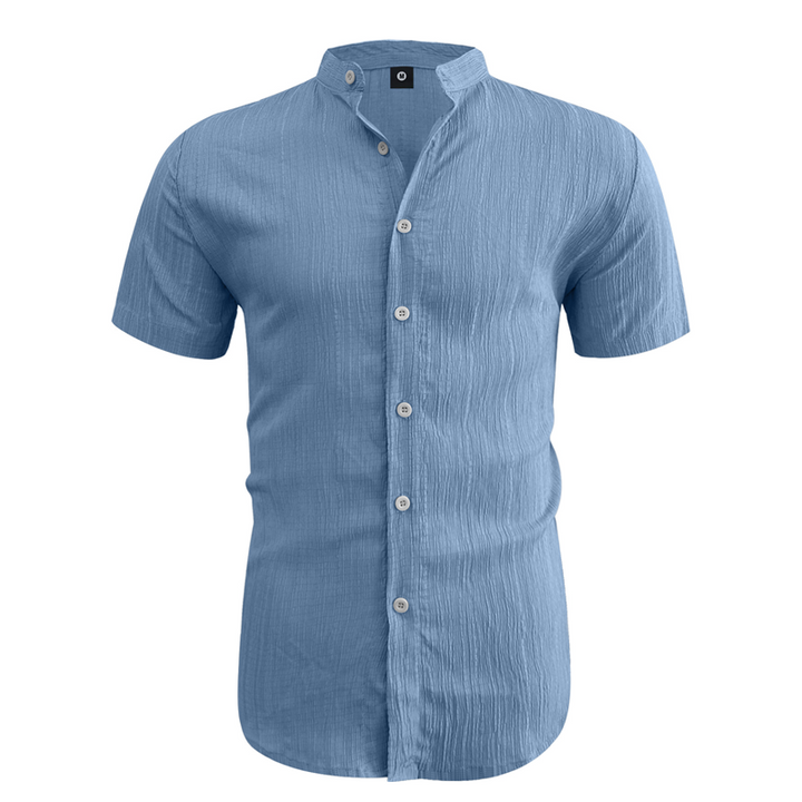 Close-up of the textured fabric and stand collar on the men's shirt