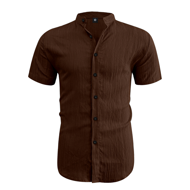 Detailed view of the button fastening and textured weave on the men's shirt