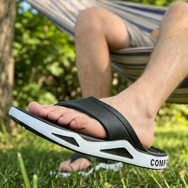 Pair of men's recovery sandals showing soft contoured footbeds