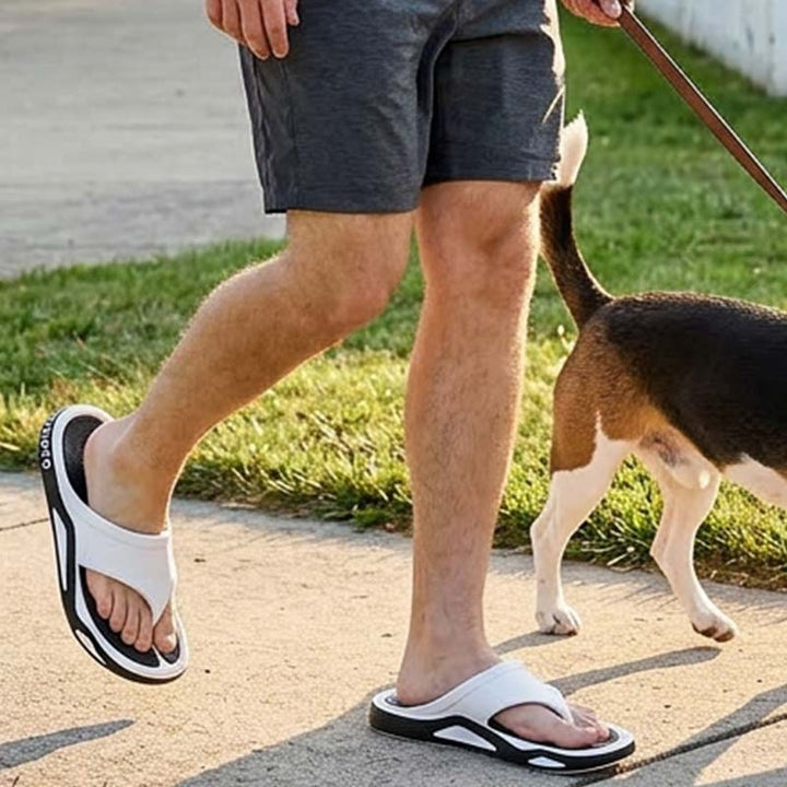 Men's cushioned recovery sandals with open toe design, angled side view