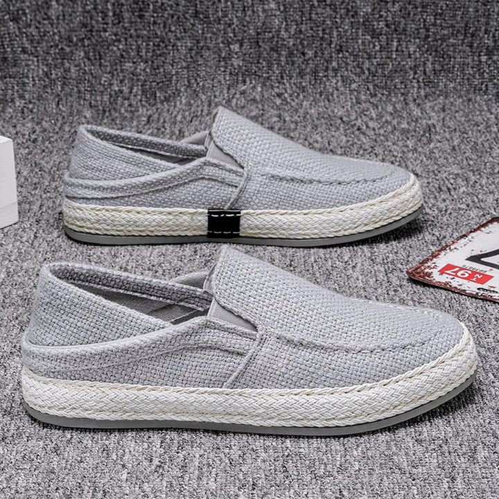 Men's canvas slip-on casual shoes shown from the side