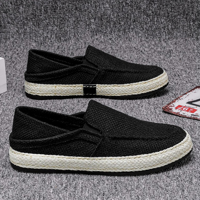 Pair of men's canvas slip-on casual shoes angled view