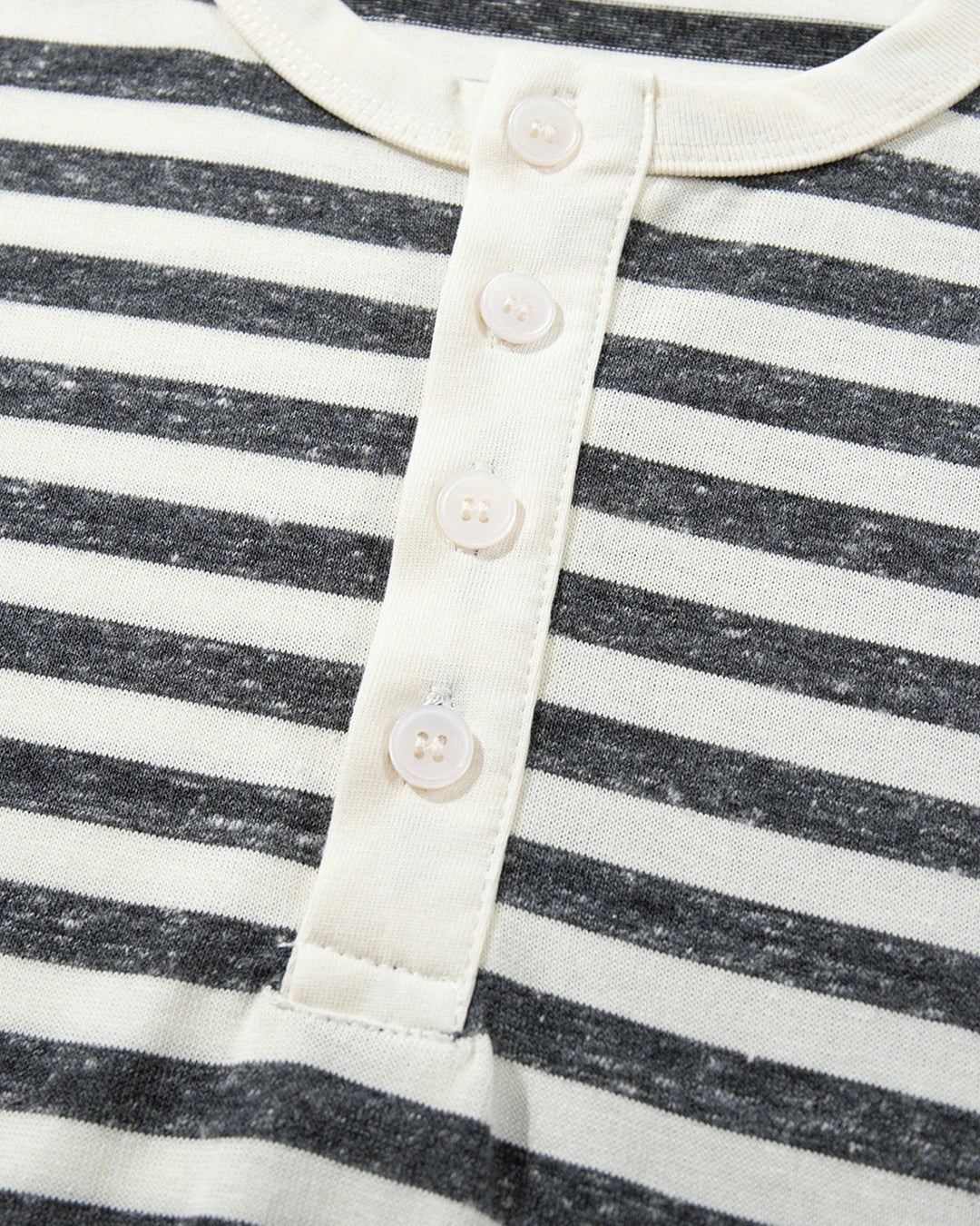 Full-length view of a model wearing the striped relaxed fit Henley T-shirt