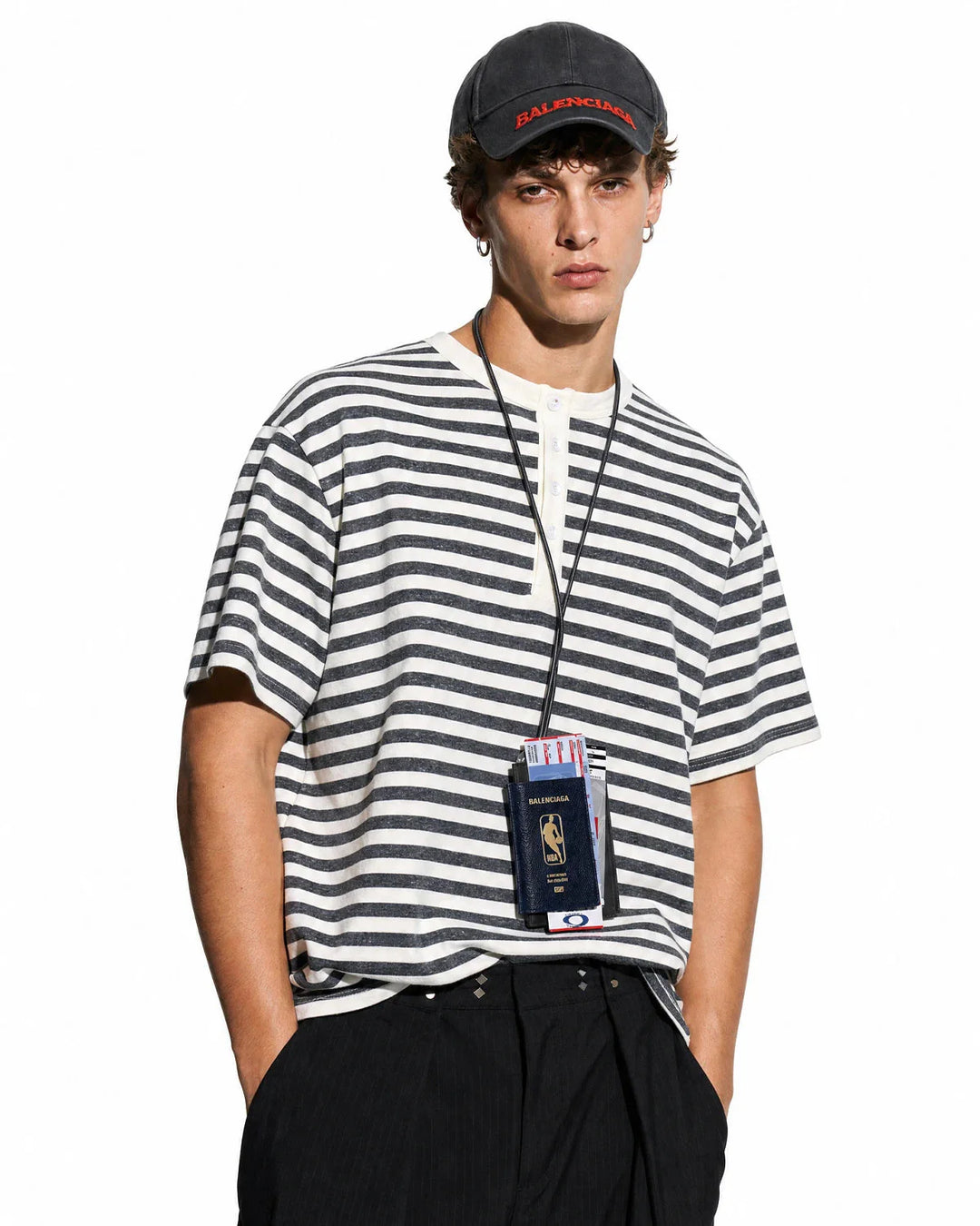 Close-up of the buttoned Henley neckline on the striped men's T-shirt