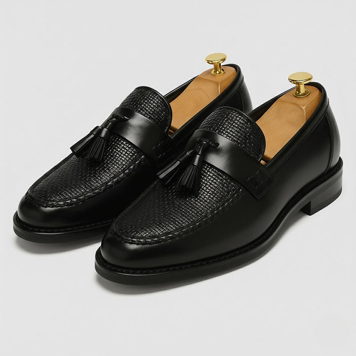 Men's tassel dress loafers with rounded toe shown from the front angle