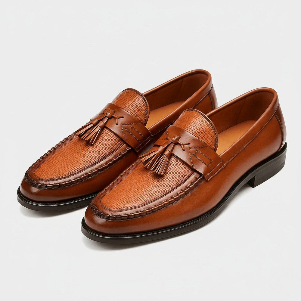Pair of men's rounded toe tassel dress loafers viewed from the side