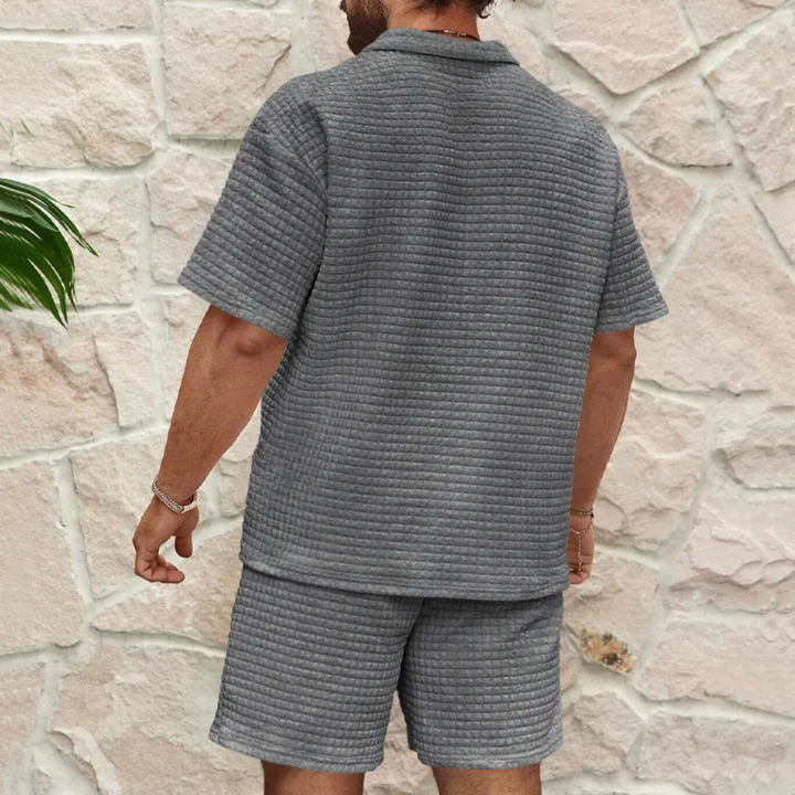 Men's textured waffle knit polo and matching shorts set, angled front view