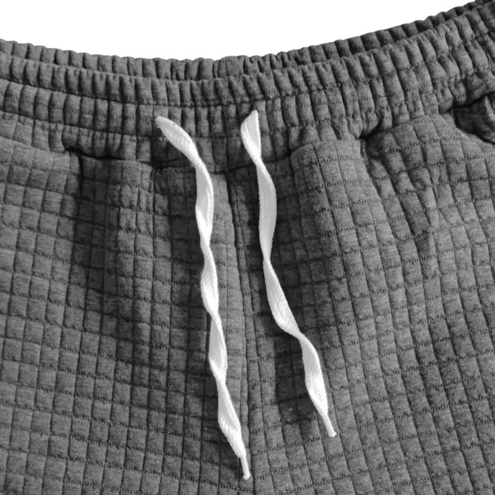 Men's waffle knit polo and shorts set styled as a casual summer outfit