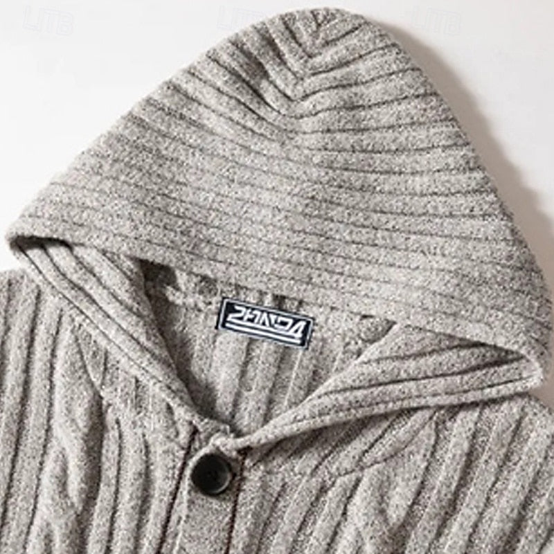 Hood detail on a men's cable knit cardigan