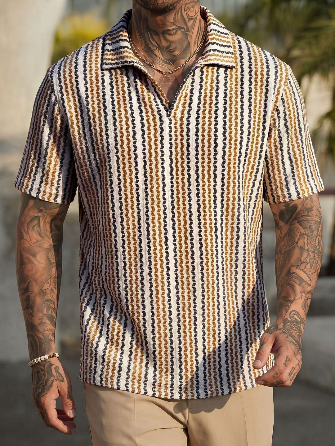 Model wearing men's Aztec jacquard polo shirt in a side pose