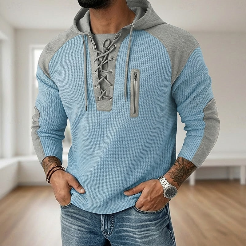 Close-up of the waffle knit texture on a men's hooded jumper