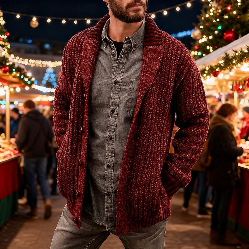 Close-up of the chunky knitted texture and shawl collar on a men's cardigan.